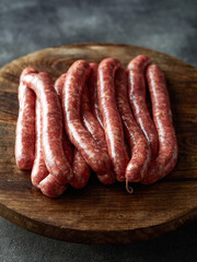 Raw Beef bratwurst. German sausages. Rinderbratwurst. Fresh raw beef sausages. Close up.