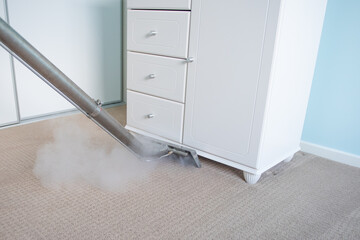 Steam Carpet Cleaning Of Carpets In A Bedroom - professional carpet cleaning	