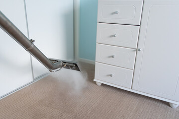 Steam Carpet Cleaning Of Carpets In A Bedroom - professional carpet cleaning	