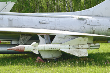suspended missile armament under the wing of a combat fighter