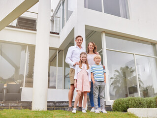 Mother, father and kids in real estate home for happy family portrait and wealthy lifestyle in the...