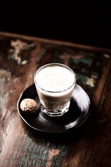 Coffee with milk on dark wooden background. Soft focus. Copy space.