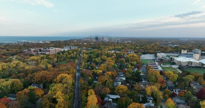 Aerial panorama of Chicago North Shore suburbs by the Lake Michigan with colorful autumn trees at fall season.  