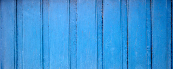 Tekstura desek malowanych na niebiesko, stara zabudowa, ornament drewniany
