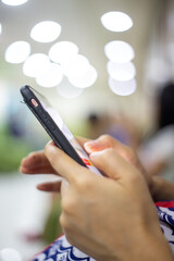 hand of pregnant woman using smartphone