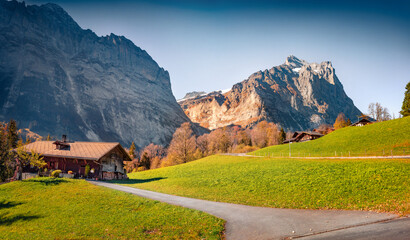 Mountain Swiss farm in Bernese Oberland Alps. Picturesque autumn scene of Switzerland countryside....