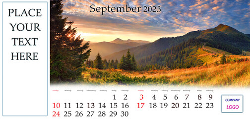 September 2023. Desktop monthly calendar template with place logo and contact information. Set of calendars with amazing landscapes. Fantastic autumn sunrise on Carpahian mountains, Ukraine, Europe..