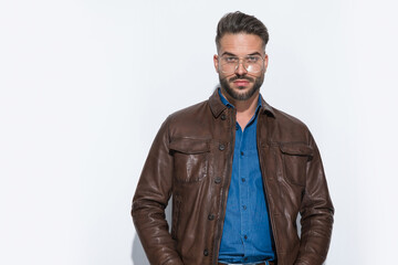 Fototapeta premium sexy casual man wearing a brown leather jacket