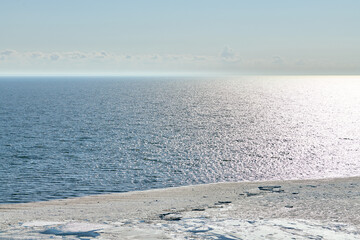 Melting sea ice seasonal natural phenomenon of coming spring, ice on water melts from burning sun....
