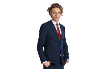 confident businessman wearing navy blue suit with red tie and posing