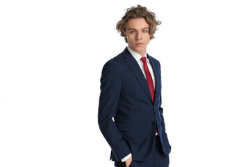 attractive young businessman posing with hands in pockets