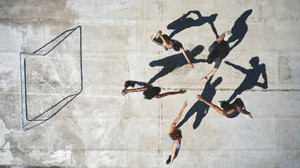 Top view, soccer team and stretching for fitness, workout or game training on Portugal city building rooftop. Sports men, women and football player people in warmup exercise for teamwork health match