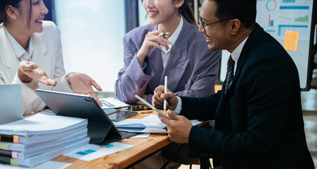 Group of Asian business meeting in planning design in creative business discussing work in the office. © Nuttapong punna