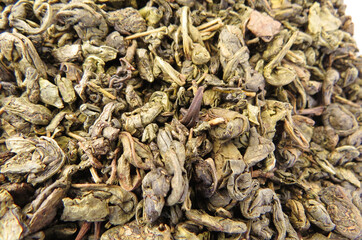 Dry tea with medicinal herbs in bulk in a bag close-up. Phytotherapy and healthy eating  Dried herbs tea leaves. Different dry herbs and flowers for making healthy tea background.