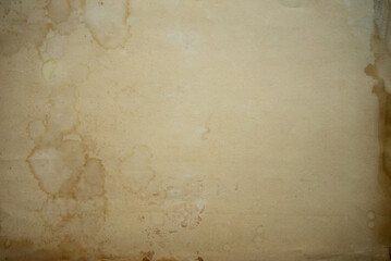 The background is made of yellow old paper.The texture of an old sheet of paper.Yellowed vintage cardboard letterhead.