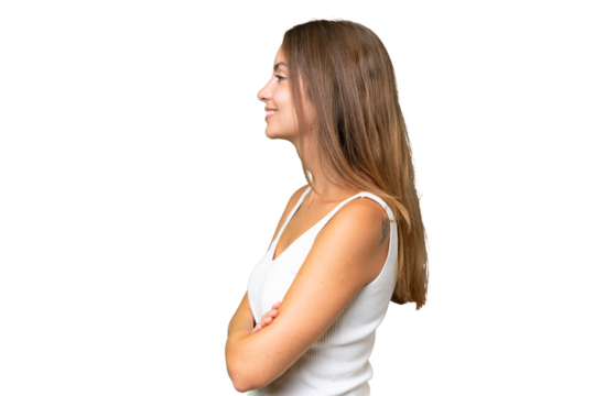 Young pretty woman over isolated background in lateral position