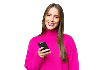 Young beautiful caucasian woman over isolated background using mobile phone