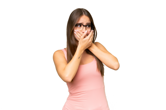 Young pretty caucasian woman over isolated background covering mouth and looking to the side