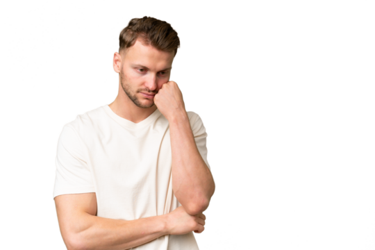 Young blonde caucasian man over isolated background with tired and bored expression