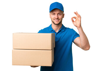 Delivery caucasian man over isolated background showing ok sign with fingers