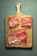 Italian style meat snacks on the cutting board.