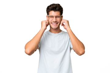 Young caucasian handsome man over isolated background frustrated and covering ears