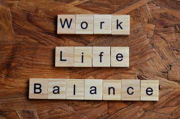 Work Life Balance text on wooden square, business quotes