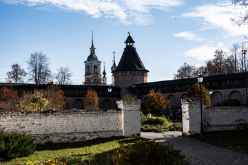 ancient stone monastery against the backdrop of autumn nature in Suzdal