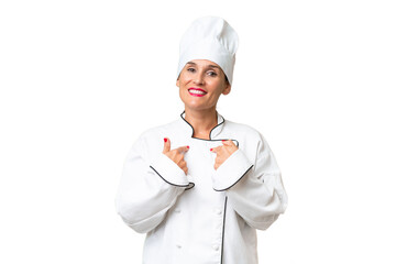 Middle-aged chef woman over isolated background with surprise facial expression