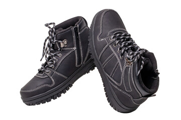 Winter boots. Close-up of a pair elegant black leather winter boots with laces and rivets isolated on white. Clipping path. Macro. Autumn shoe fashion for child boy.
