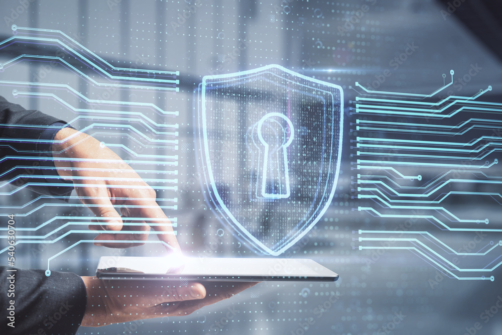 Poster Close up of businessman hand pointing at smartphone with abstract glowing secure web safety and protection hologram on blurry office interior background. Double exposure.