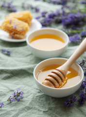 Jar with honey and fresh lavender flowers