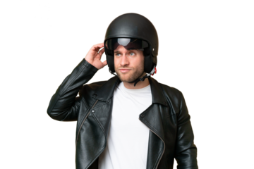 Young caucasian man with a motorcycle helmet isolated on green chroma background having doubts
