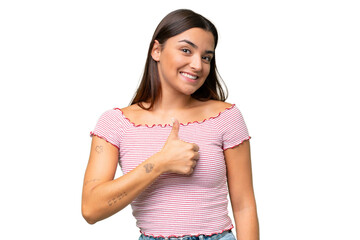Fototapeta premium Young caucasian woman isolated on green chroma background giving a thumbs up gesture
