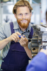 happy man talking to apprentice about engine fixing - obrazy, fototapety, plakaty