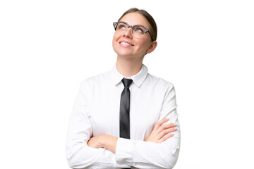 Young business caucasian woman over isolated background looking up while smiling