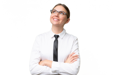 Young business caucasian woman over isolated background looking up while smiling