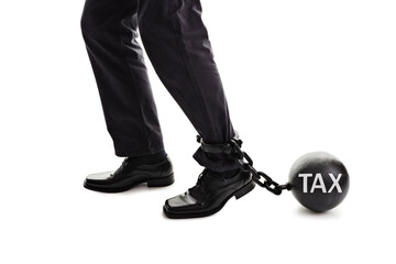 Tax ball and chain restraining businessman as he tries to walk concept for business financial...