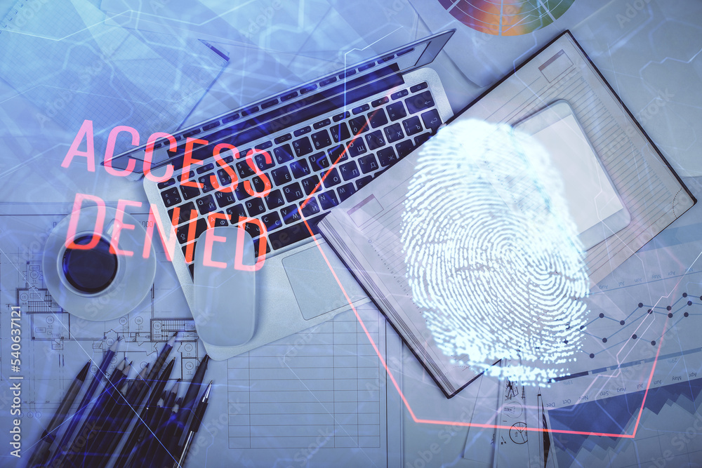 Poster Finger print over computer on the desktop background. Top view. Double exposure. Concept of securitization.