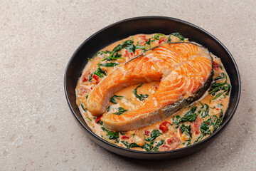 Close up of creamy garlic butter tuscan salmon. Pan seared salmon in a delicious creamy sauce with...