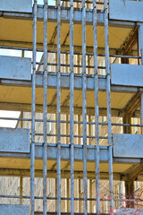 Fragment of the facade of a multi-storey house on an autumn day