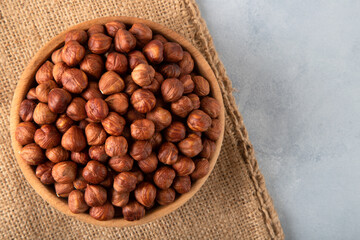 Top view of a bowl full of hazelnuts

