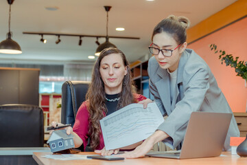 Finance,accounting,Businesswomen analyzing investment charts with calculator laptop calculate technology in office, marketing business analysis data concept