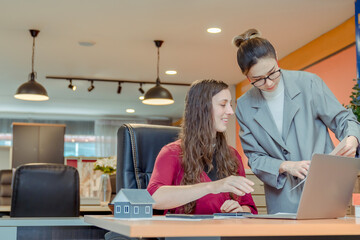 Finance,accounting,Businesswomen analyzing investment charts with calculator laptop calculate technology in office, marketing business analysis data concept