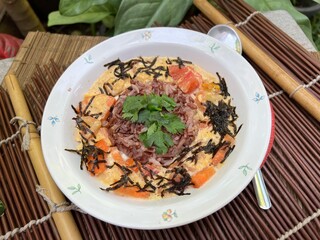 Brown rices and egg mixed tomato stir fried with soy and sesame sauce