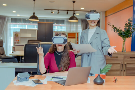 Business woman wearing virtual reality goggles touching air communicate online during vr meeting conference at office. Businesswoman african american female in formal wear using vr headset glasses