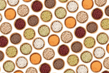 Food pattern. White beans, chickpeas, split peas, red beans, coral lentils, lentils, green beans. Isolated on white background. Top view.