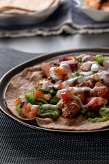 taco with chicken and tomatoes salsa