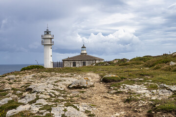Fototapeta na wymiar Lighthouse of cape of Tourinan in Muxia, Costa da Morte, Death Coast, Galicia, Spain.
