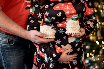 
 Ссылка ×Название:
A man hugs a pregnant woman. A pregnant woman with her hands on her belly is waiting for a newborn baby on Christmas New Year's Eve. waiting for a miracle.